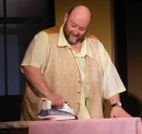 Ted (Colin Clark) does the ironing.