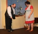 Ted (Colin Clark) shows a young Sylvia (Kayliegh Knox) the vomit her husband left on his slipper